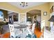 Bright dining room with hardwood floors, an archway to the living room, and a view of the staircase at 595 W Oak Hill Ln, Castle Rock, CO 80108