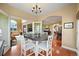 A dining room with an open floor plan and views into other living areas at 595 W Oak Hill Ln, Castle Rock, CO 80108