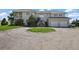 Elegant two-story home with a circular driveway and a spacious two-car garage at 595 W Oak Hill Ln, Castle Rock, CO 80108
