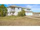 Two-story home featuring a balcony, lush landscaping, and a convenient two-car garage at 595 W Oak Hill Ln, Castle Rock, CO 80108