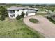 Spacious two-story home with a charming upper balcony, attached two car garage and circular driveway at 595 W Oak Hill Ln, Castle Rock, CO 80108