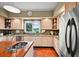 A kitchen with stainless steel appliances, granite countertops, and a beautiful view at 595 W Oak Hill Ln, Castle Rock, CO 80108