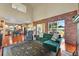 A beautiful living room with hardwood floors, vaulted ceilings, and brick accents at 595 W Oak Hill Ln, Castle Rock, CO 80108
