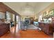 A large living room features a fireplace with vaulted ceilings and hardwood floors at 595 W Oak Hill Ln, Castle Rock, CO 80108