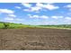 Well-maintained training area with soft dirt and a white fence, designed for equestrian activities and training at 595 W Oak Hill Ln, Castle Rock, CO 80108