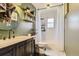 Well-appointed bathroom featuring a modern vanity, stylish fixtures, and a shower with white subway tile at 1756 S Memphis St, Aurora, CO 80017