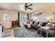 Cozy living room boasts modern decor, a comfortable sectional sofa, and a bright window with natural light at 1756 S Memphis St, Aurora, CO 80017