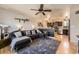 Inviting living room featuring stylish furniture, a ceiling fan, and an open layout connecting to the kitchen at 1756 S Memphis St, Aurora, CO 80017