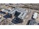 Aerial view of a multi-story apartment building with unique rooftop parking and an inviting outdoor courtyard and pool at 20 Wilcox St # 203, Castle Rock, CO 80104