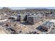 An aerial shot of modern apartments, blending seamlessly into the landscape, located near local businesses and picturesque hills at 20 Wilcox St # 203, Castle Rock, CO 80104