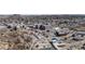 Elevated view of a modern residential building complex, surrounded by ample parking and scenic natural landscapes at 20 Wilcox St # 203, Castle Rock, CO 80104