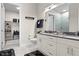 Bright bathroom features a double vanity, modern fixtures, and large walk-in shower with tiled walls at 20 Wilcox St # 203, Castle Rock, CO 80104