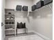 This walk-in closet features built-in shelving, a seating area, and ample storage space at 20 Wilcox St # 203, Castle Rock, CO 80104