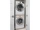 Modern stacked washer and dryer unit offer convenience in a compact laundry area at 20 Wilcox St # 203, Castle Rock, CO 80104