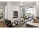 Cozy living room with stylish decor, a comfortable seating area, and large windows for natural light at 20 Wilcox St # 203, Castle Rock, CO 80104