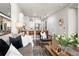 Open-concept living area features modern furnishings, a kitchen with bar seating, and a relaxed ambiance at 20 Wilcox St # 203, Castle Rock, CO 80104