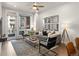 Bright living room with a large window and balcony access, offering city views and natural light at 20 Wilcox St # 203, Castle Rock, CO 80104