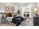 Comfortable main bedroom boasts natural light, sleek decor, and views of the outside building at 20 Wilcox St # 203, Castle Rock, CO 80104