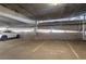 Well-lit parking garage with reserved parking spots at 20 Wilcox St # 203, Castle Rock, CO 80104