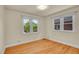 Inviting bedroom with hardwood floors, bright windows, and a neutral color scheme at 1208 S Elizabeth St, Denver, CO 80210