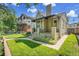 Charming home with manicured lawn, a cozy front porch, and classic architectural details at 1208 S Elizabeth St, Denver, CO 80210