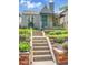 Charming bungalow featuring a beautifully landscaped front yard and inviting front entrance at 1208 S Elizabeth St, Denver, CO 80210