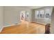 Bright living room featuring gleaming hardwood floors and archway at 1208 S Elizabeth St, Denver, CO 80210