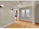 Bright living room featuring hardwood floors and an archway to another room at 1208 S Elizabeth St, Denver, CO 80210