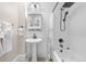 Updated bathroom with modern fixtures, tiled walls, and bathtub with shower at 328 E Dakota Ave, Denver, CO 80209