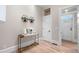 The entryway offers hardwood floors, an ornate doorframe and stylish decor at 328 E Dakota Ave, Denver, CO 80209