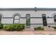 Charming facade with arched window, green door, and well-maintained brickwork at 328 E Dakota Ave, Denver, CO 80209
