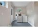 Functional laundry room with washer, dryer, and exterior access at 328 E Dakota Ave, Denver, CO 80209