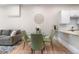 Open living room with kitchen, dining area, and comfortable gray couch at 328 E Dakota Ave, Denver, CO 80209