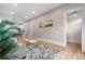 Open floor plan living room with hardwood floors, modern decor, and natural light at 328 E Dakota Ave, Denver, CO 80209