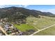 Aerial view of a property with rolling hills and scenic mountain backdrop at 15947 S Perry Park Rd, Palmer Lake, CO 80133