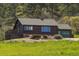 Beautiful log cabin with garage and well-maintained landscaping, offering a cozy retreat at 15947 S Perry Park Rd, Palmer Lake, CO 80133