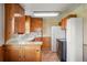 Traditional kitchen with vintage cabinets, white appliances, and tiled countertops at 15947 S Perry Park Rd, Palmer Lake, CO 80133