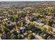 Expansive aerial shot of a residential neighborhood with tree-lined streets and various home styles at 2358 N Ogden St # B, Denver, CO 80205