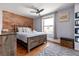 Bedroom with a large brick wall and a window at 2358 N Ogden St # B, Denver, CO 80205