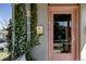 Close up of the front door with ivy, mail box, and brick columns at 2358 N Ogden St # B, Denver, CO 80205