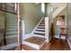 Entryway featuring a staircase with detailed banisters and hardwood flooring at 2358 N Ogden St # B, Denver, CO 80205