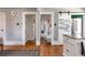 Hallway features hardwood floors, white trim, and a sliding barn door at 2358 N Ogden St # B, Denver, CO 80205