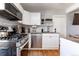 Updated kitchen features stainless steel appliances, granite countertops, and subway tile backsplash at 2358 N Ogden St # B, Denver, CO 80205