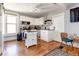 Bright kitchen with white cabinets, stainless steel appliances, and wood flooring at 2358 N Ogden St # B, Denver, CO 80205