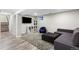 Finished basement featuring a couch, shaggy rug, and an entertainment area with recessed lighting at 14428 W Ellsworth Pl, Golden, CO 80401