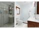 Well-maintained bathroom with a glass-enclosed shower, vanity, and fixtures for a clean and modern look at 14428 W Ellsworth Pl, Golden, CO 80401
