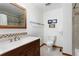 Neutral bathroom featuring a ceramic tile shower and mosaic accent trim at 14428 W Ellsworth Pl, Golden, CO 80401