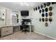 Inviting bedroom featuring an ergonomic workspace, providing a comfortable and productive environment at 14428 W Ellsworth Pl, Golden, CO 80401