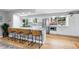 Spacious kitchen island with granite countertops, stainless steel appliances, and bar stool seating at 14428 W Ellsworth Pl, Golden, CO 80401