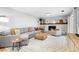Bright living room with a cozy fireplace, neutral color palette, and stylish decor for a welcoming atmosphere at 14428 W Ellsworth Pl, Golden, CO 80401